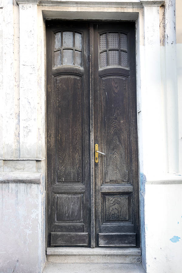 Photo 26118: Narrow, panelled, black and unpainted double door with formed door lights