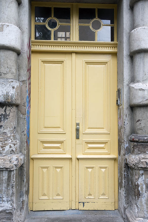 Photo 26158: Panelled, carved, yellow double door with top window