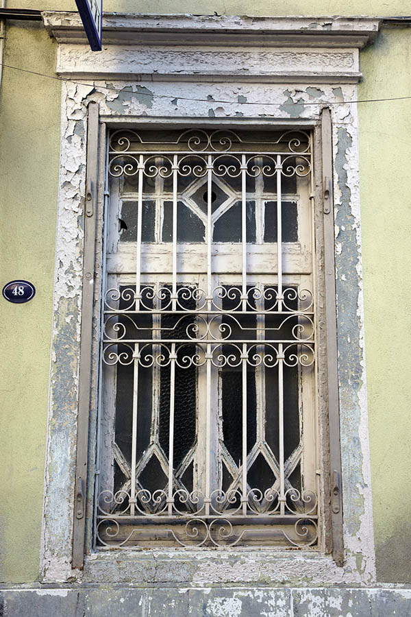 Photo 26455: Decayed, white window with lattice
