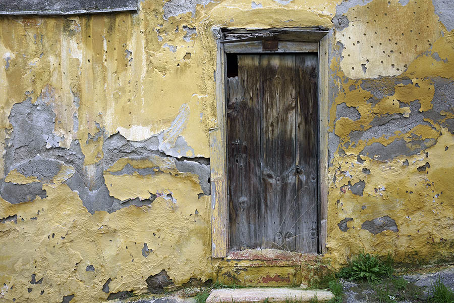 Photo 26489: Decayed, unpainted door of boards