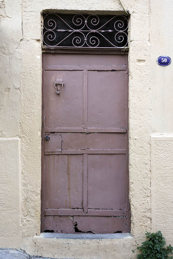 Photo 26624: Worn, pink door with top window with lattice