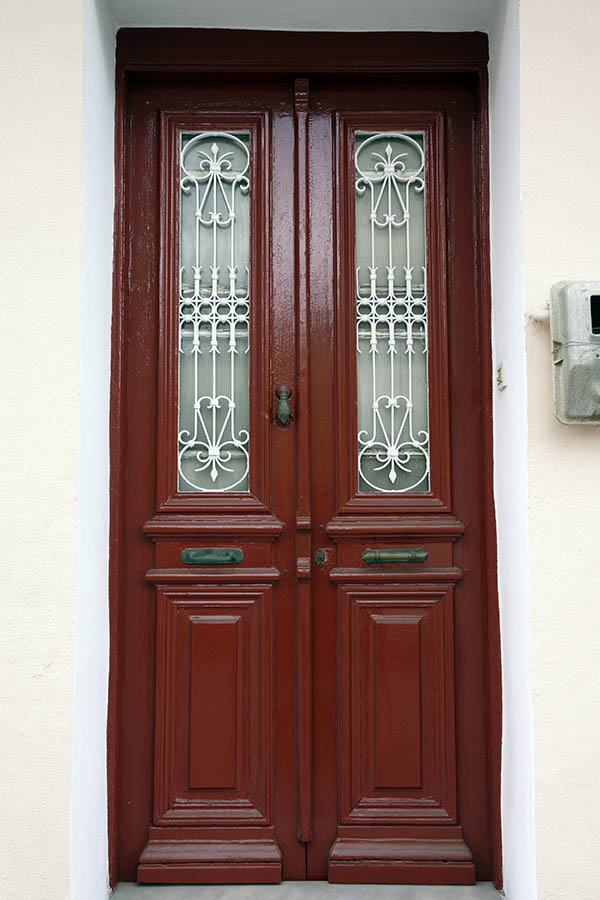 Photo 26719: Narrow, dark red, panelled double door with white lattice