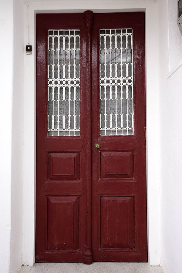 Photo 26728: Narrow, red, panelled double door with white lattice