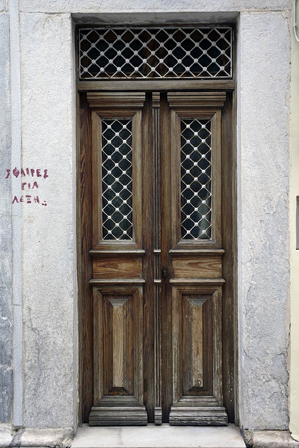Photo 26808: Narrow, oiled, panelled double door with top window and white lattice