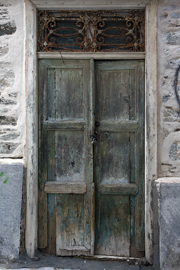 Photo 26869: Decayed, unpainted and green, panelled double door with top window in a white frame