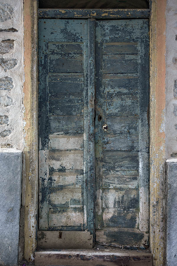 Photo 26871: Decayed, narrow, blue and teal double door of boards in a yellow frame