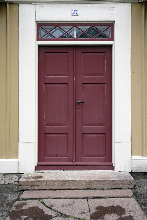 Photo 27056: Red, panelled double door in a white frame with top window