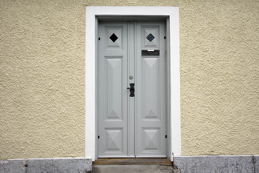 Photo 27134: Panelled, grey double doow with white frame and diamond-shaped door lights