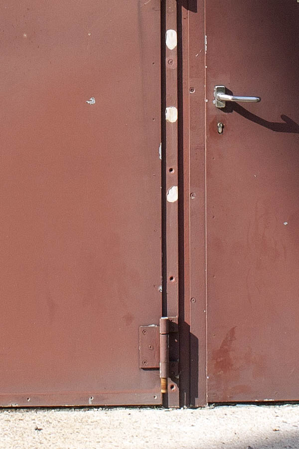 Photo 00048: Facade with red-brown metal gate and door