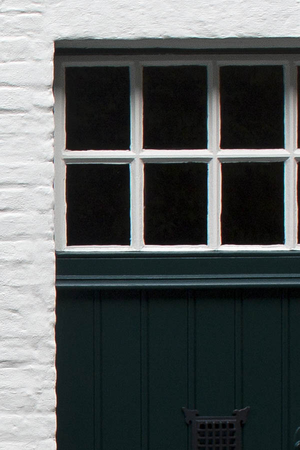 Photo 00159: Green door and window with white details