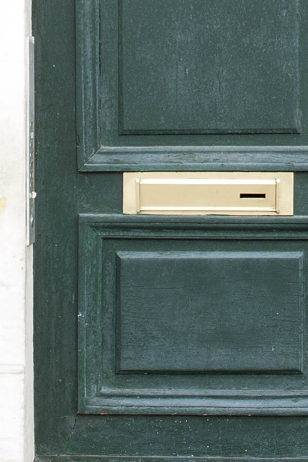 Photo 02208: Worn, panelled, green double door with latticed top windows