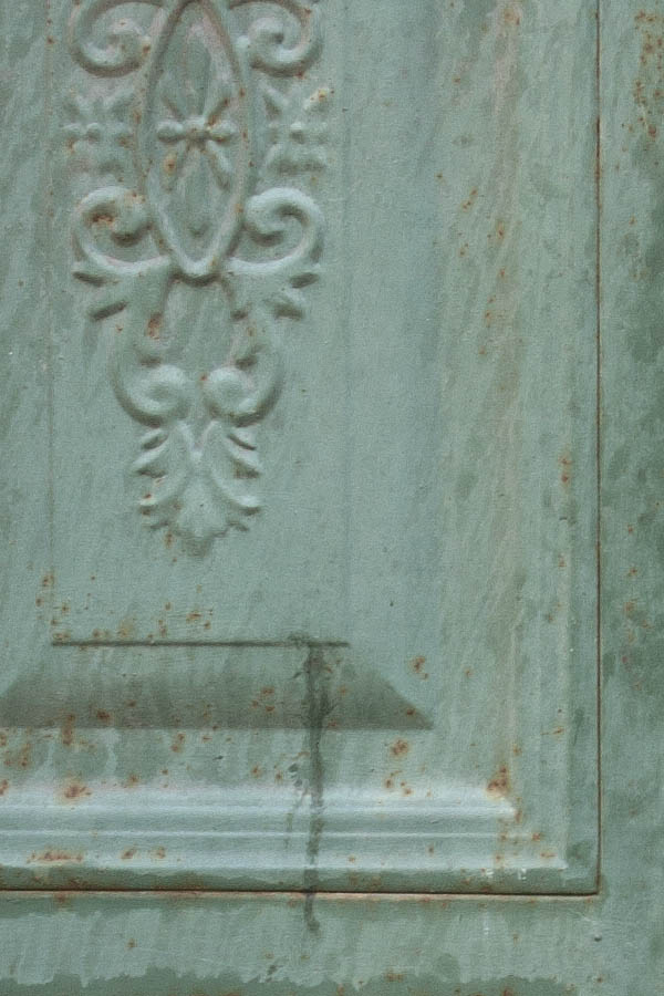 Photo 03119: Panelled, green metal double door in pilasters