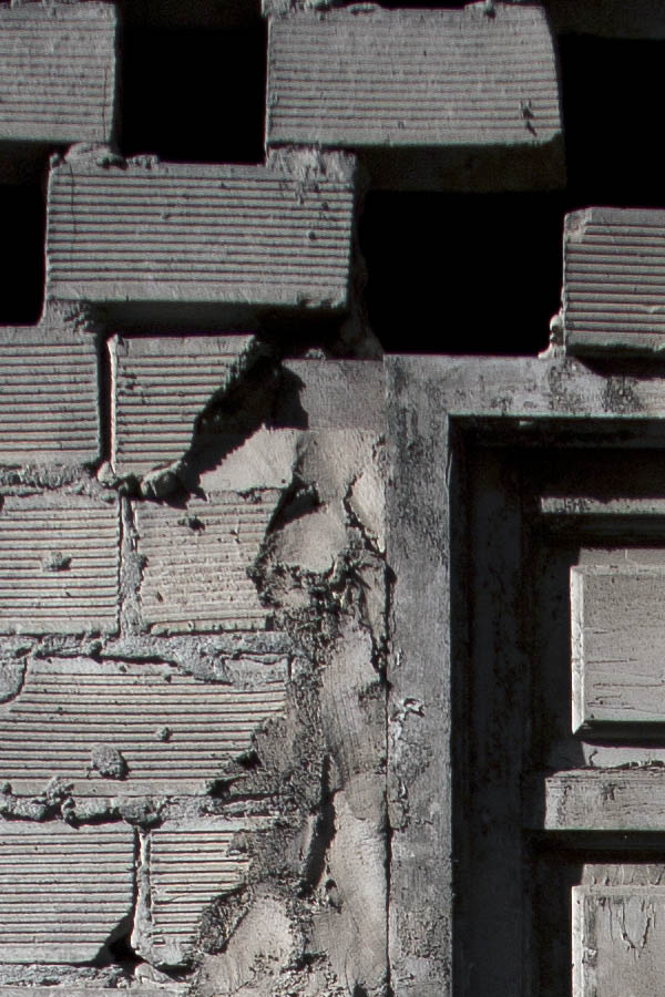 Photo 03326: Grey, panelled door in a rough wall