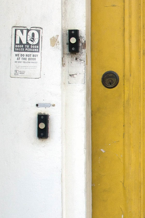 Photo 05287: Worn, panelled, yellow door