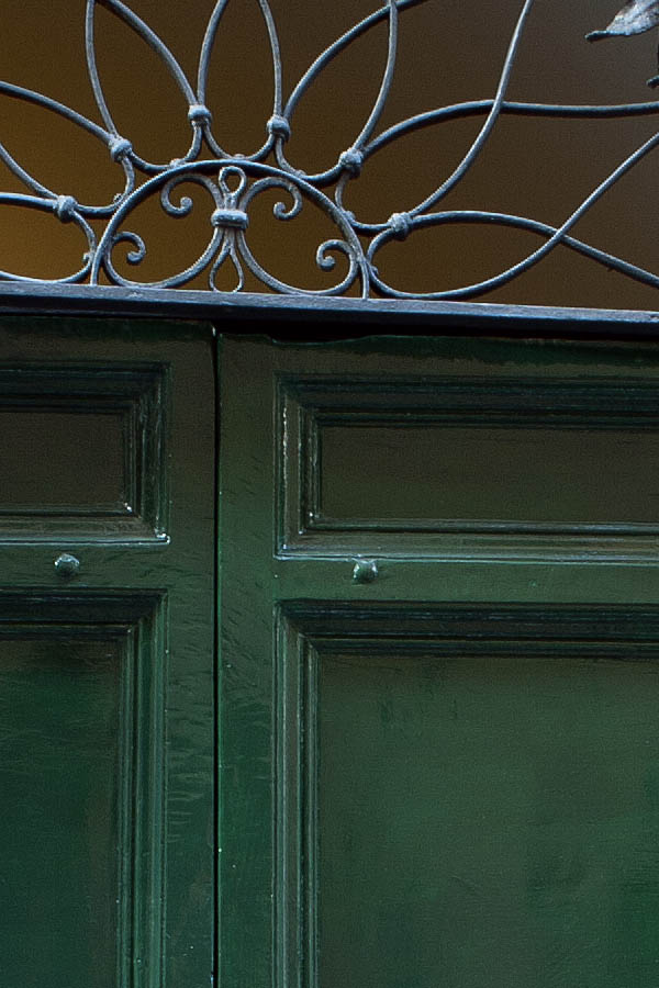 Photo 08077: Panelled, green double door with latticed fan light and pilaster