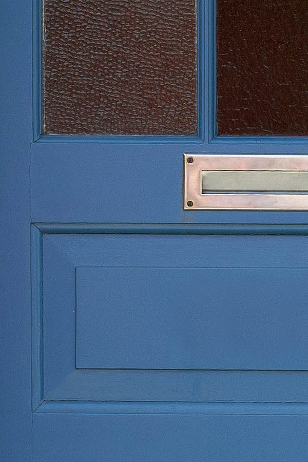 Photo 08645: Lopsided, panelled, blue door with door light