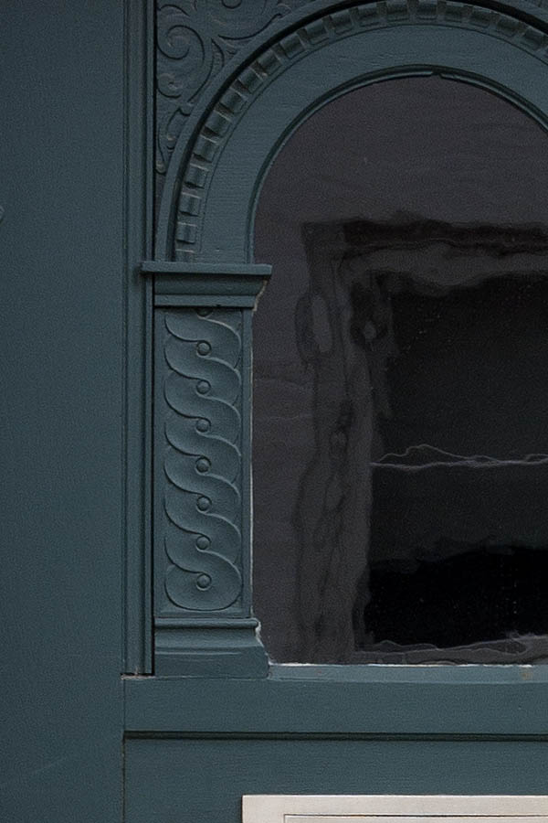 Photo 08919: Carved, panelled, teal door with formed door light