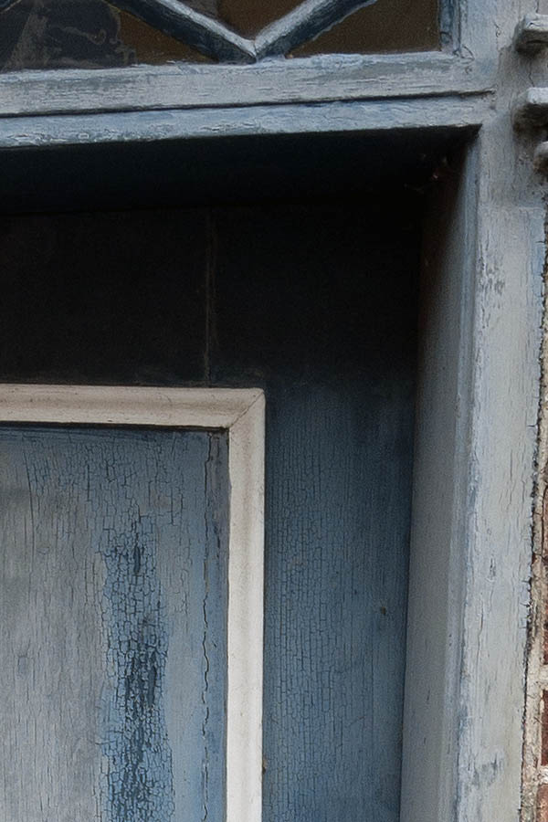 Photo 08941: Very lopsided, decayed, panelled, light blue and white door with top window