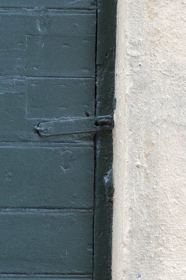 Photo 10031: Narrow, teal door made of planks
