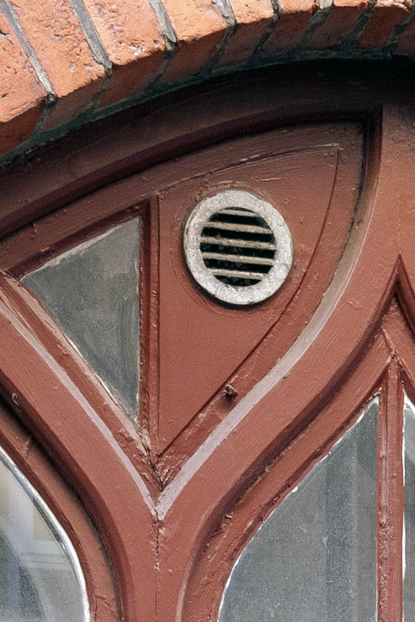 Photo 10122: Formed, brown window with three frames and 12 panes