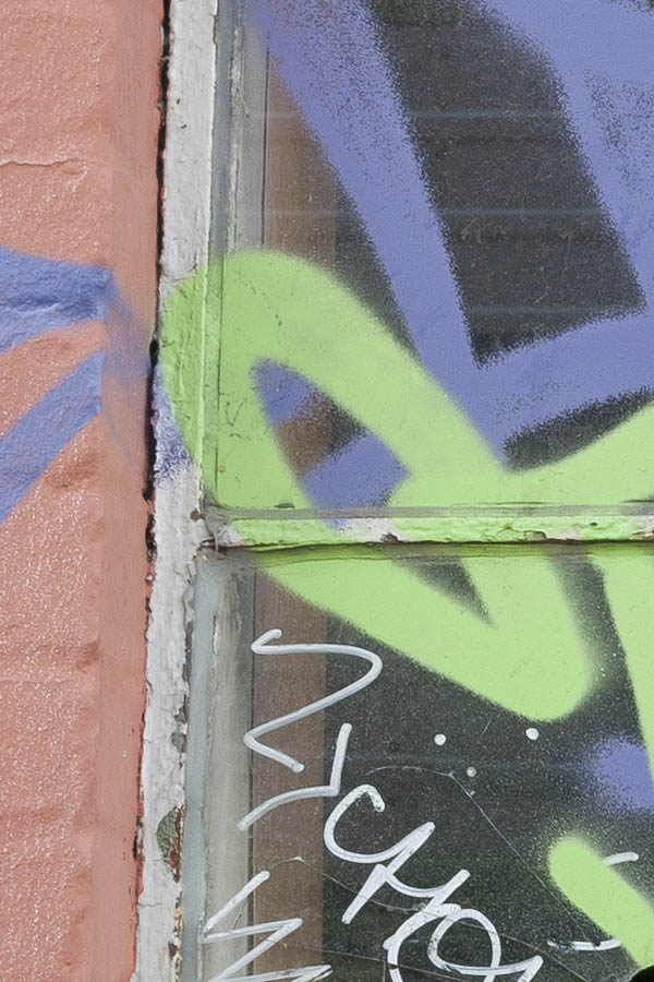Photo 10538: Formed, grey metal window with two frames and six panes