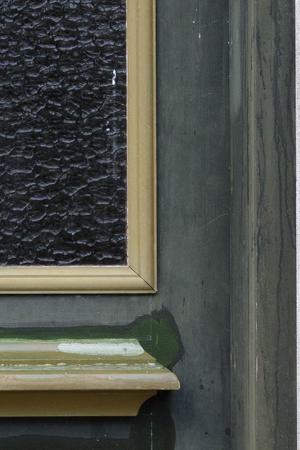 Photo 11159: Panelled, brown and green double door under repair. Top window and door lights.