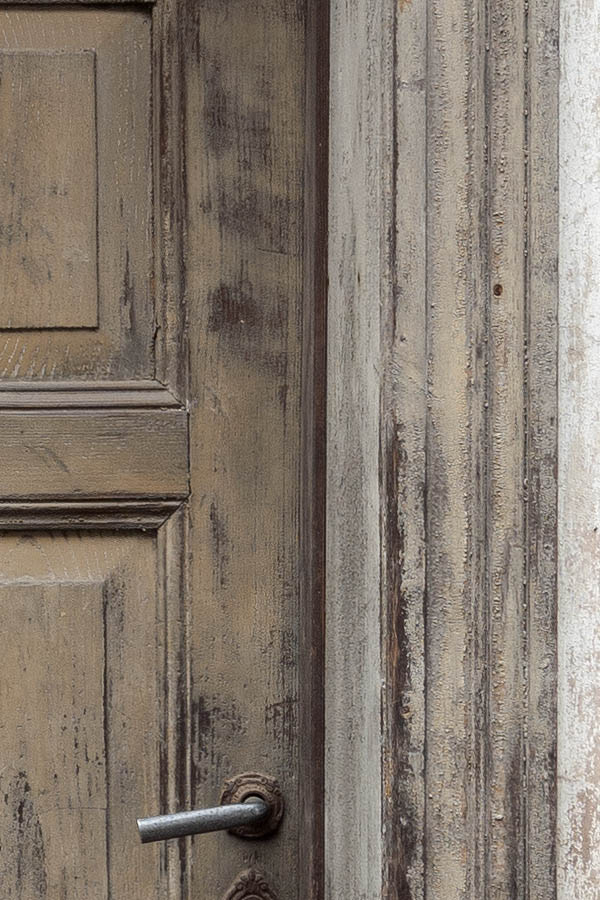 Photo 12480: Worn, panelled, unpainted door with top window
