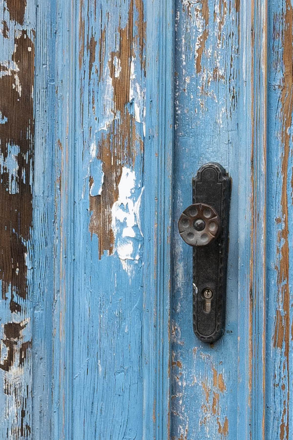 Photo 12733: Worn, panelled, blue double door with top window under repair