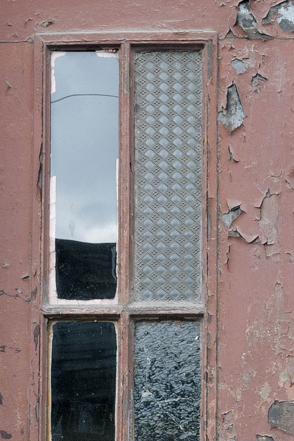 Photo 13680: Worn, panelled, brown double door with top window and door lights