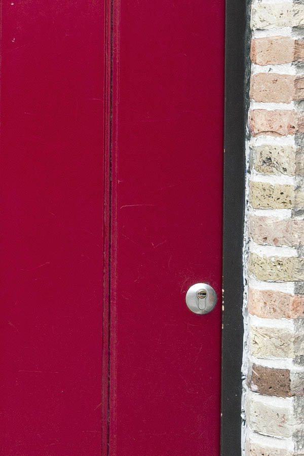 Photo 15742: Formed, cerise red door made of planks
