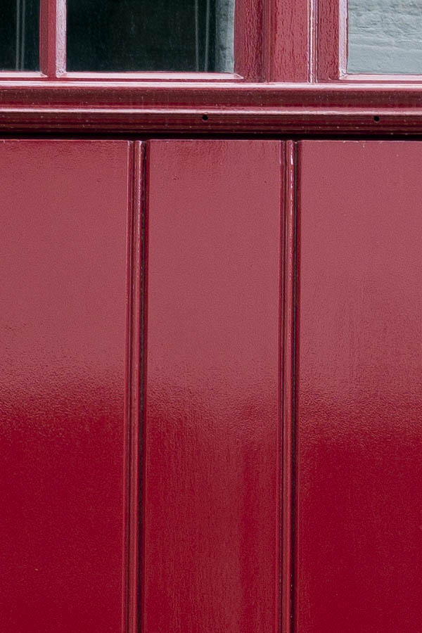 Photo 16050: Red door made of planks with top window
