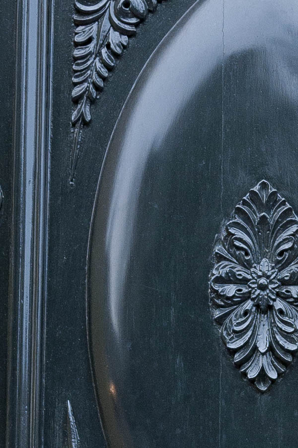 Photo 16110: Carved, panelled, black door