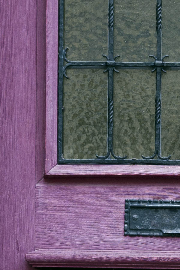 Photo 16224: Panelled, purple door with white top window and black, latticed door light
