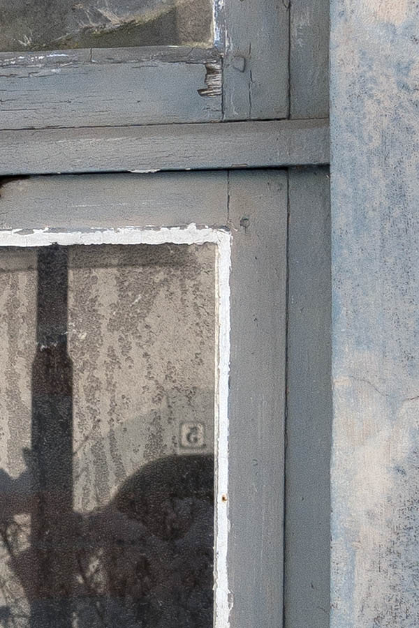 Photo 16999: Decayed, formed, grey T-post window with three frames and six panes
