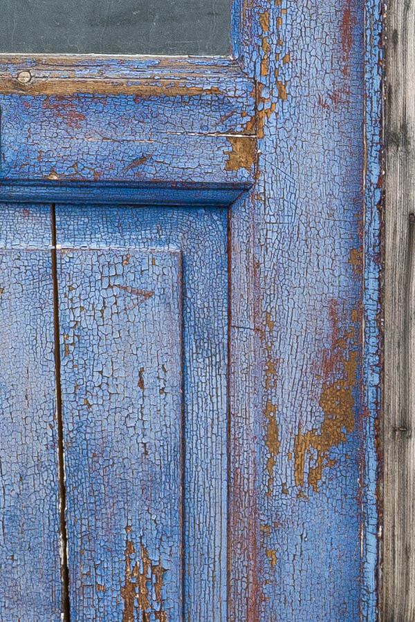 Photo 17389: Worn, panelled, blue and unpainted door with door lights