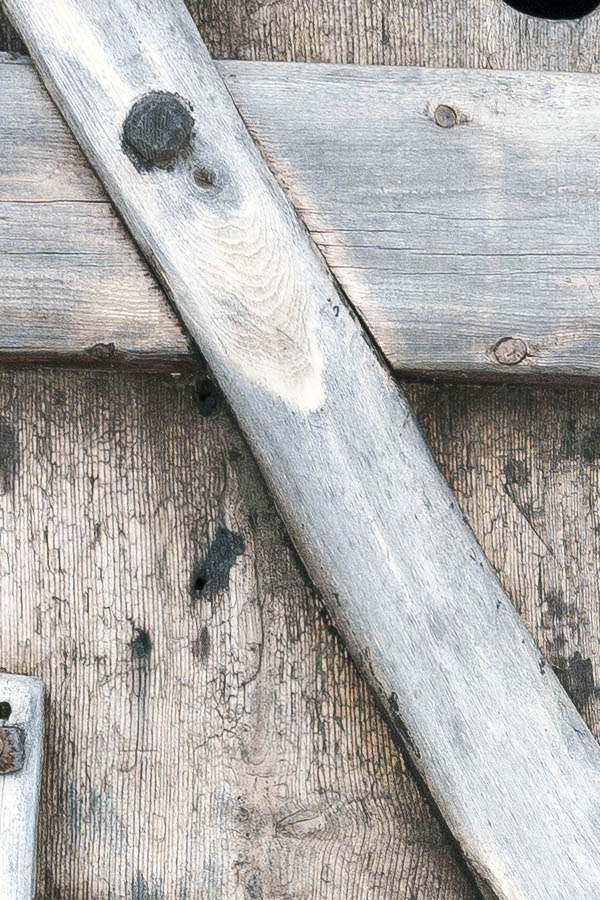 Photo 17458: Formed, unpainted door made of boards and branches