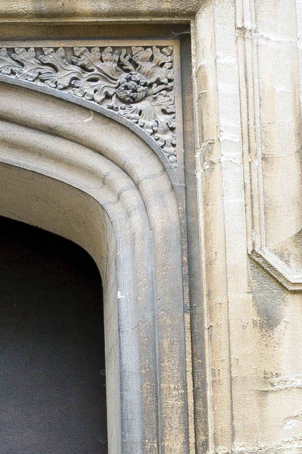 Photo 18823: No door. A door blocked with brown plywood. Mounted in a large sandstone pilaster.