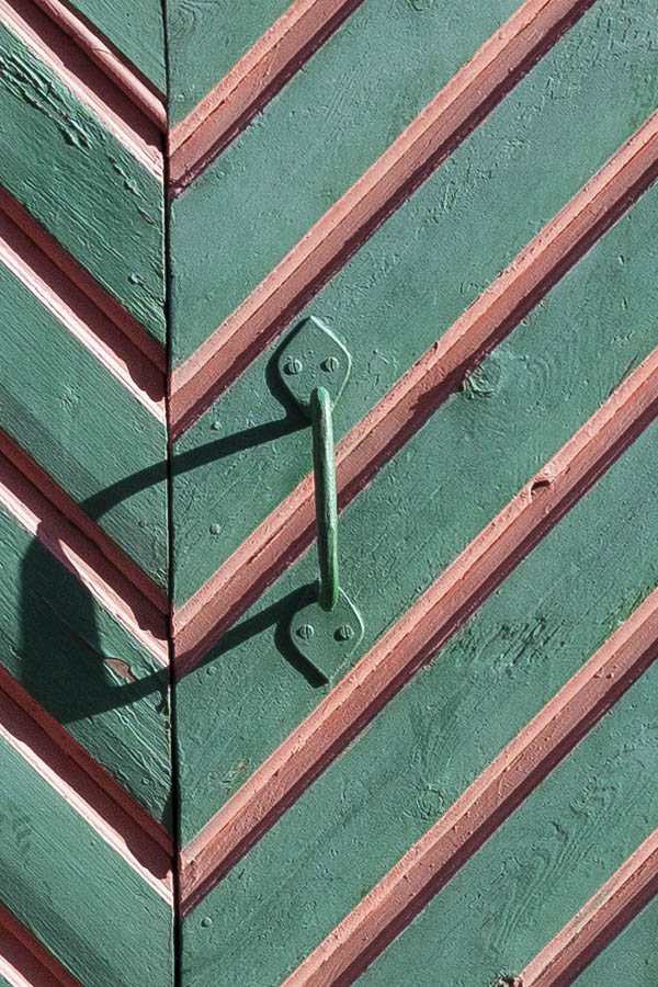 Photo 20295: Green and red garage door of diagonal boards