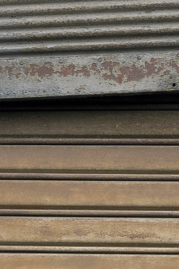 Photo 23994: Decayed, brown security shutter