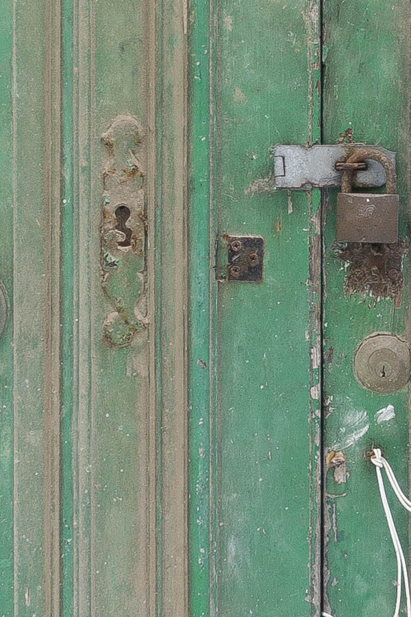 Photo 24037: Decayed, panelled, green double door with latticed top window