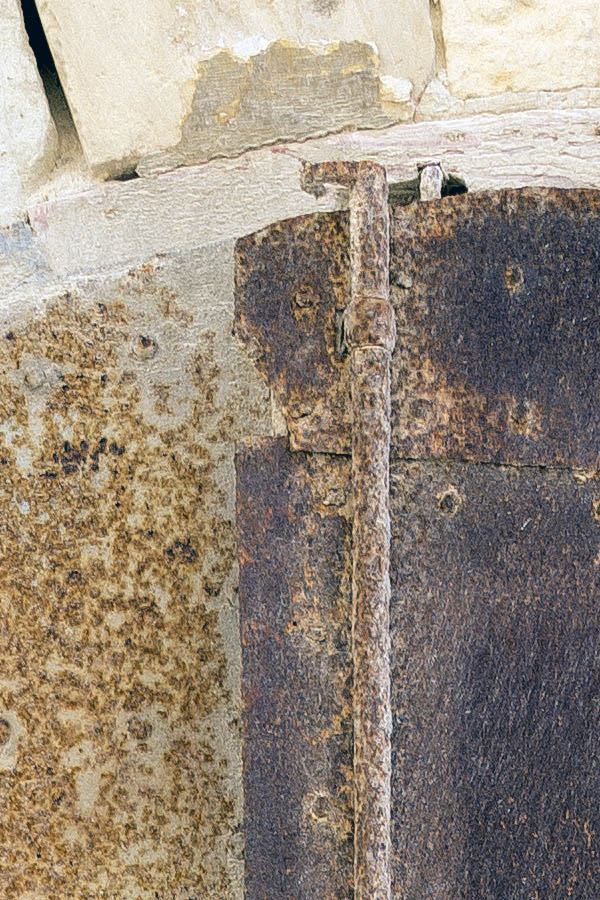 Photo 24085: Decayed, formed, lopsided, grey double door with rusty metal cover