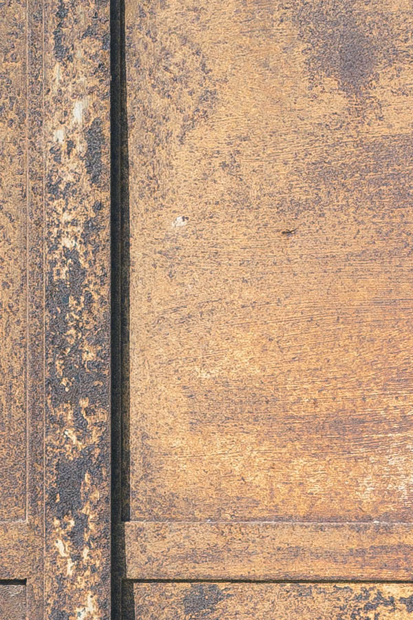 Photo 24440: Worn, rusty, brown double door and latticed top window