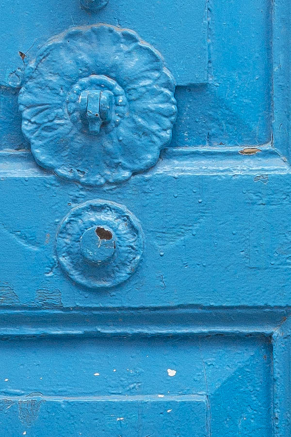 Photo 24589: Worn, panelled, light blue double door with barred top window