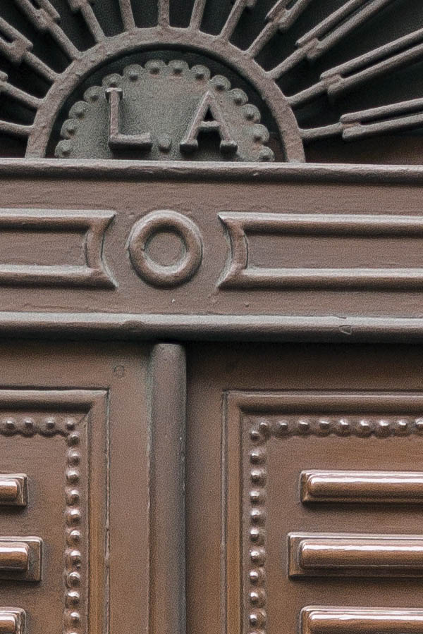 Photo 24729: Narrow, panelled, carved, brown double door with latticed fan light