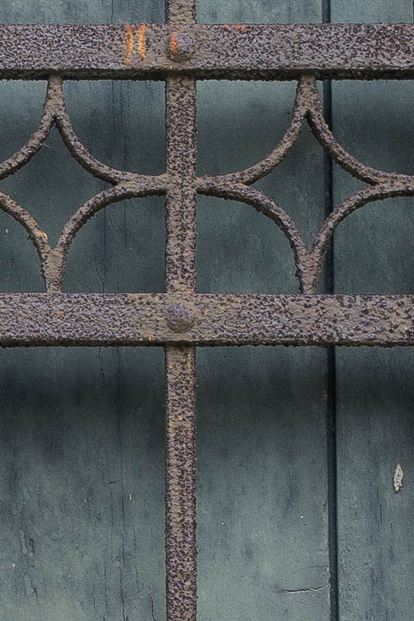 Photo 24877: Barred window with teal shutters