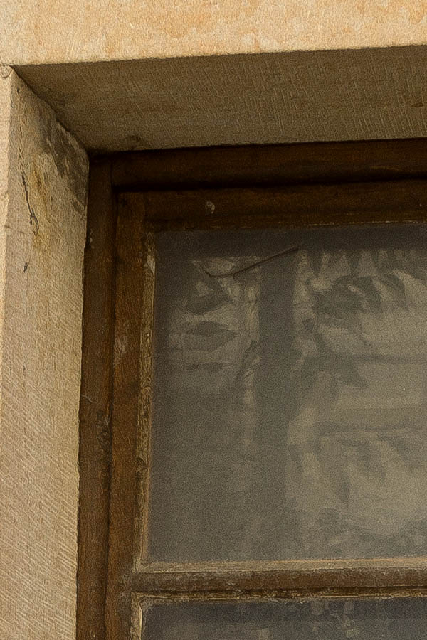 Photo 25421: Facade with a brown window with two frames and six panes mounted in a large, sandstone frame