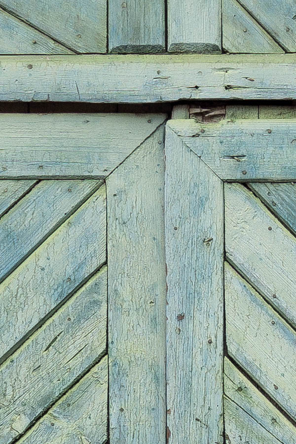 Photo 25760: Worn, panelled, light green gate with diagonal boards and minor door