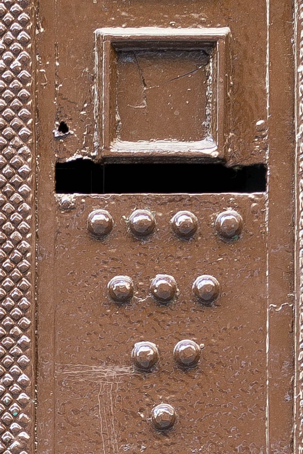 Photo 26099: Brown metal door with nails and decoration