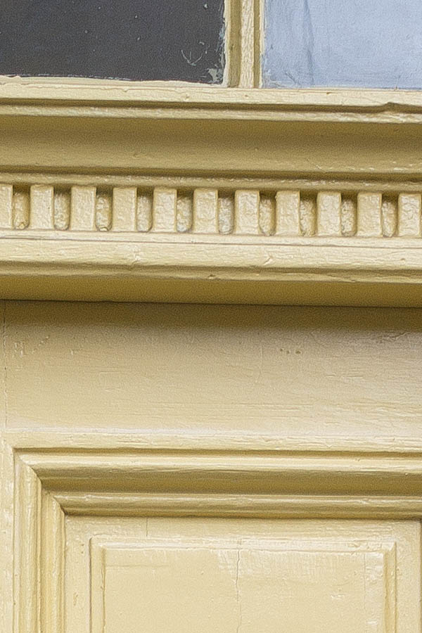 Photo 26158: Panelled, carved, yellow double door with top window