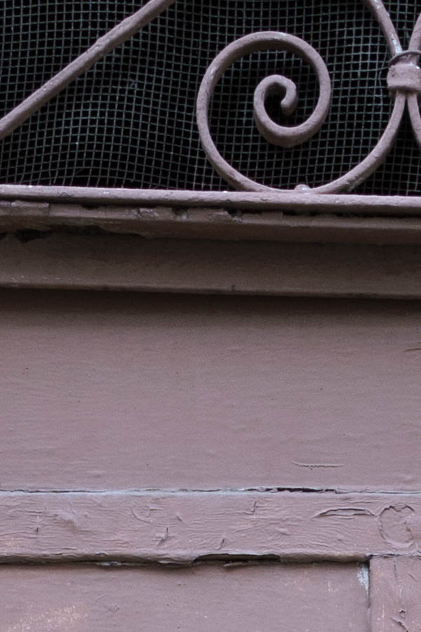 Photo 26624: Worn, pink door with top window with lattice